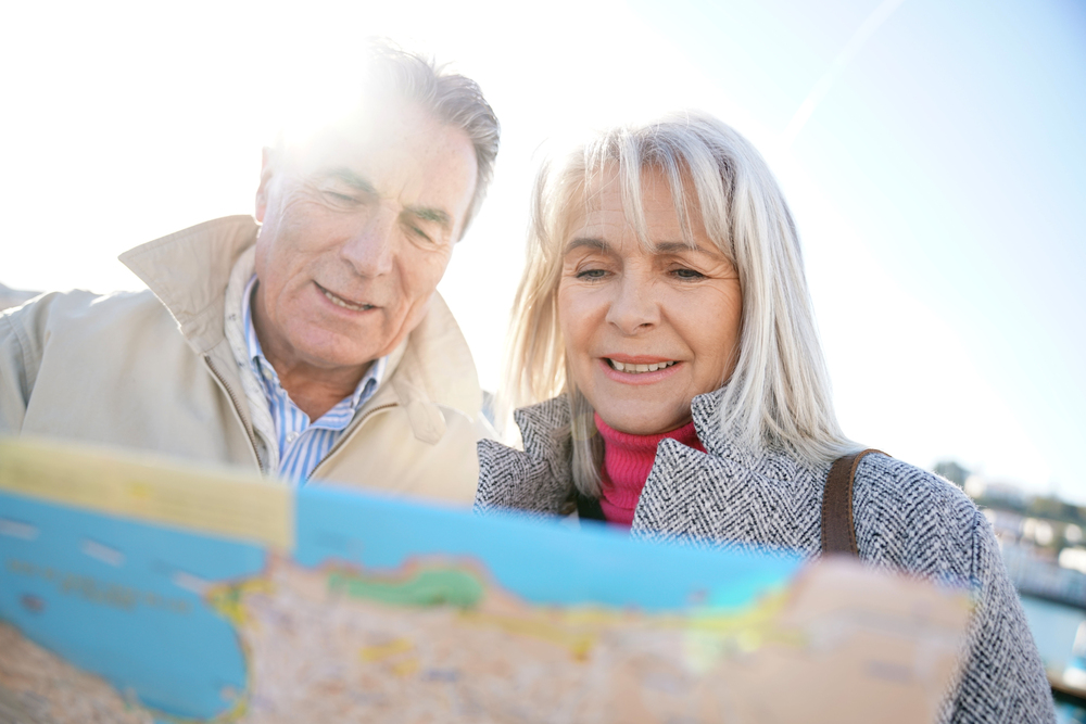 senior couple looking at a map